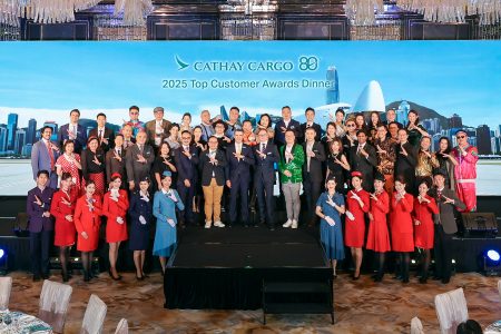 he Cathay Cargo senior team and guests pose with cabin crew dressed in heritage uniforms at the 2025 Top Customer Awards Dinner