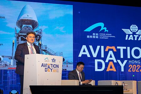 Tom Owen speaking at podium